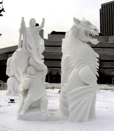 snow sculpture people and dragon